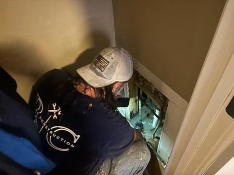 Damaged plumbing pipes exposed during repair