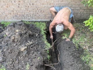 Sewer line excavation and pipe replacement