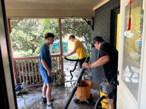 Rovira crew cleaning up after plumbing repair